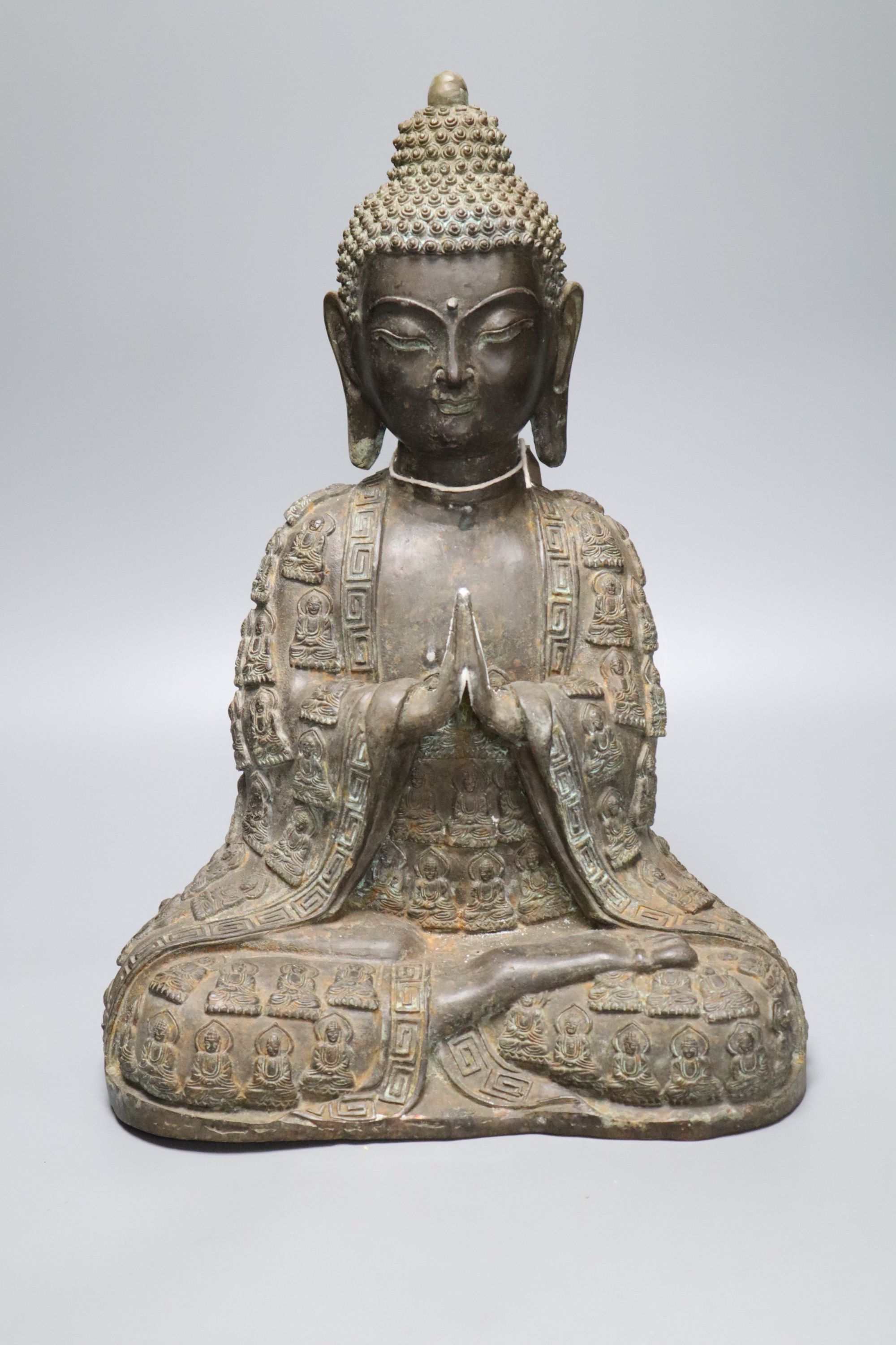A large bronze seated figure of Buddha, height 44cm